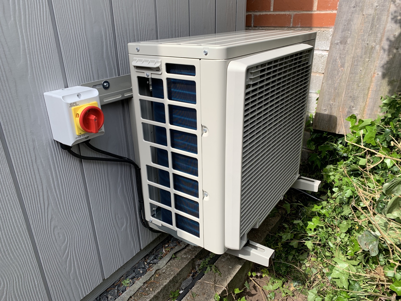 Daikin condenser unit installed on a commercial wall